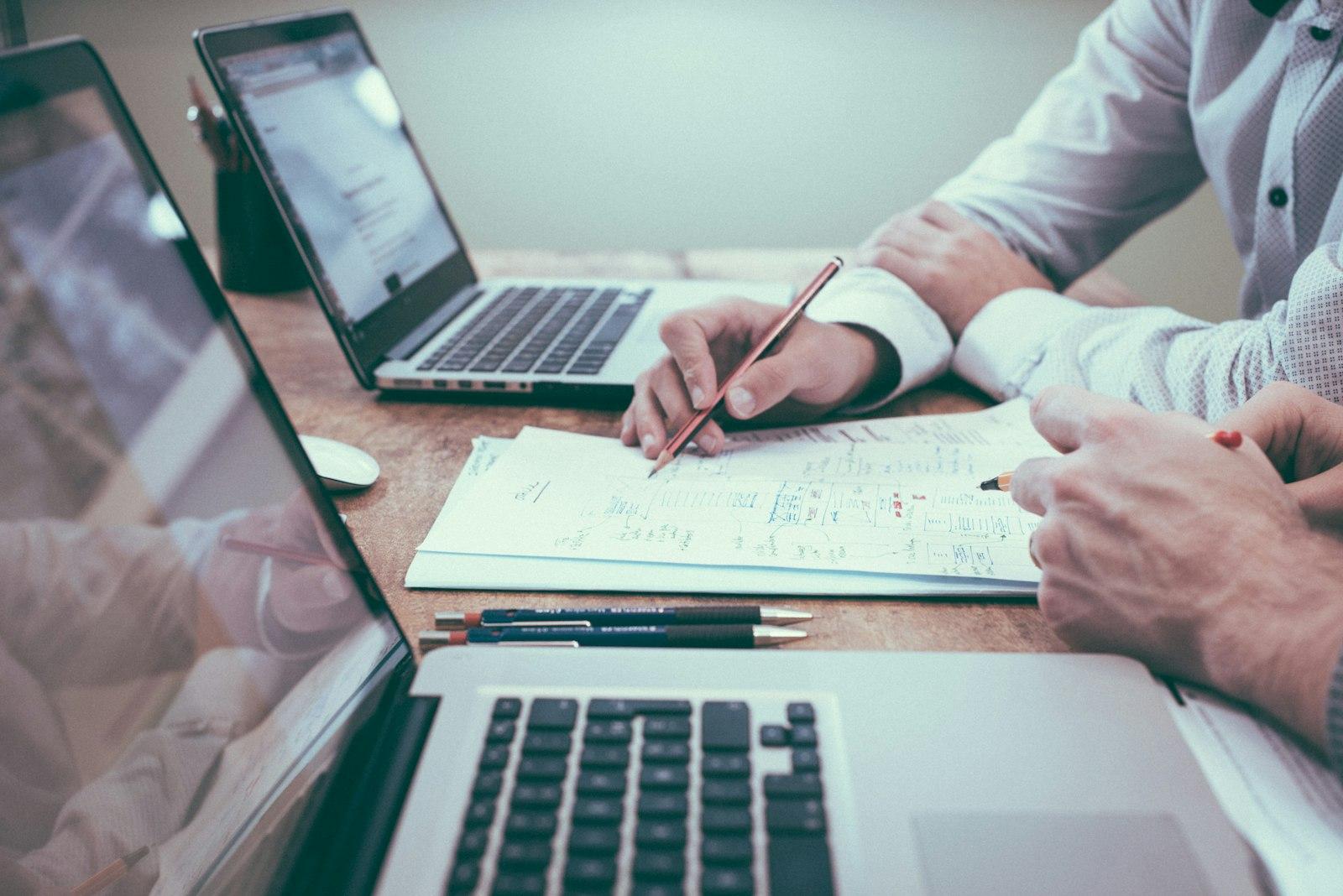 Advisors reviewing financial reports together